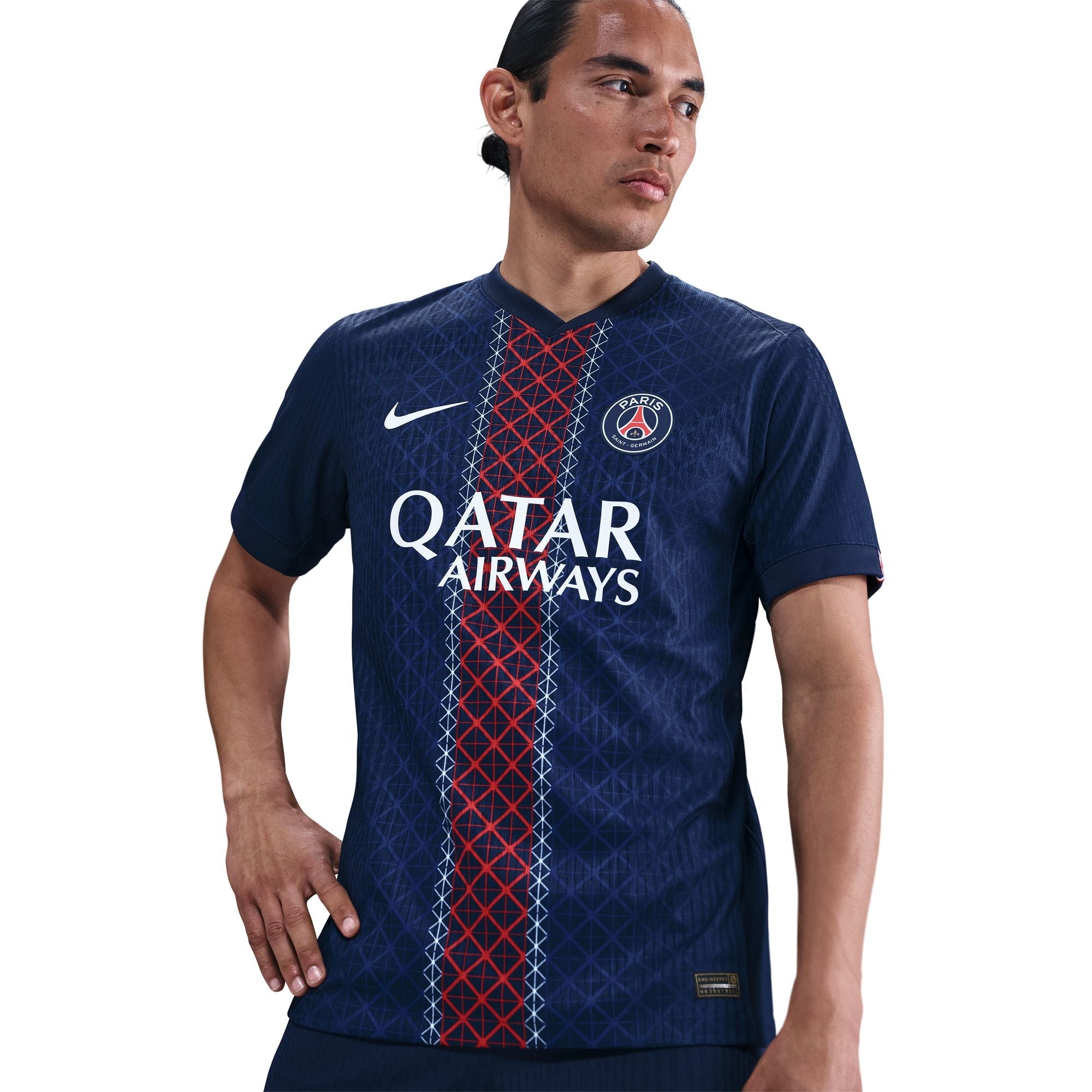 Person wearing a blue sports jersey with Qatar Airways logo on a white background