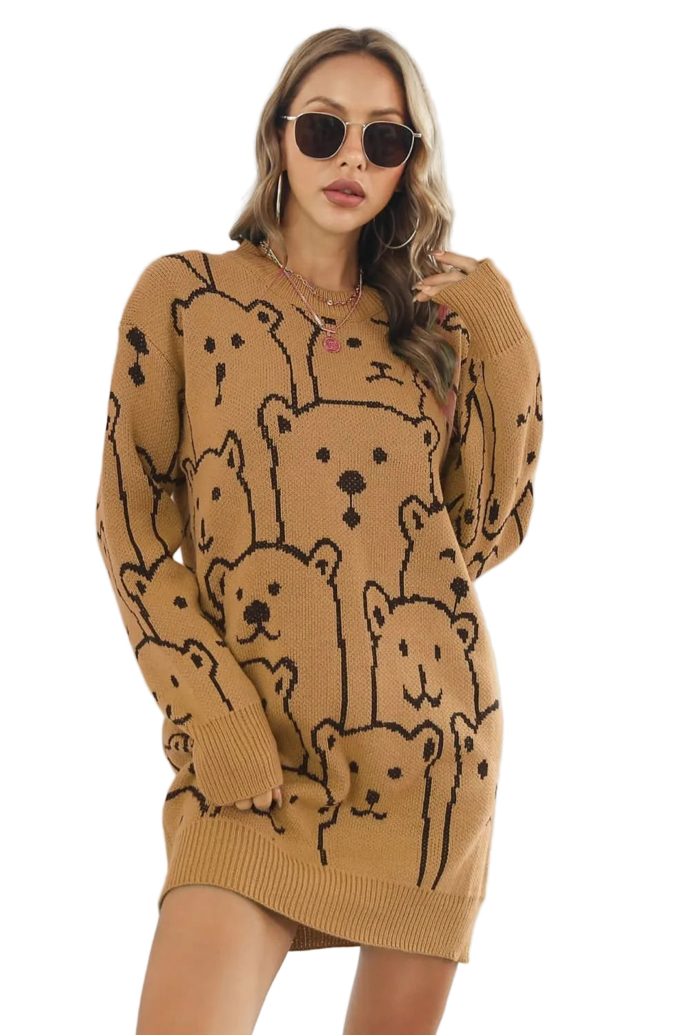 Woman wearing a brown sweater dress with bear patterns against a white background
