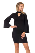 Woman wearing a black dress with bell sleeves on a white background