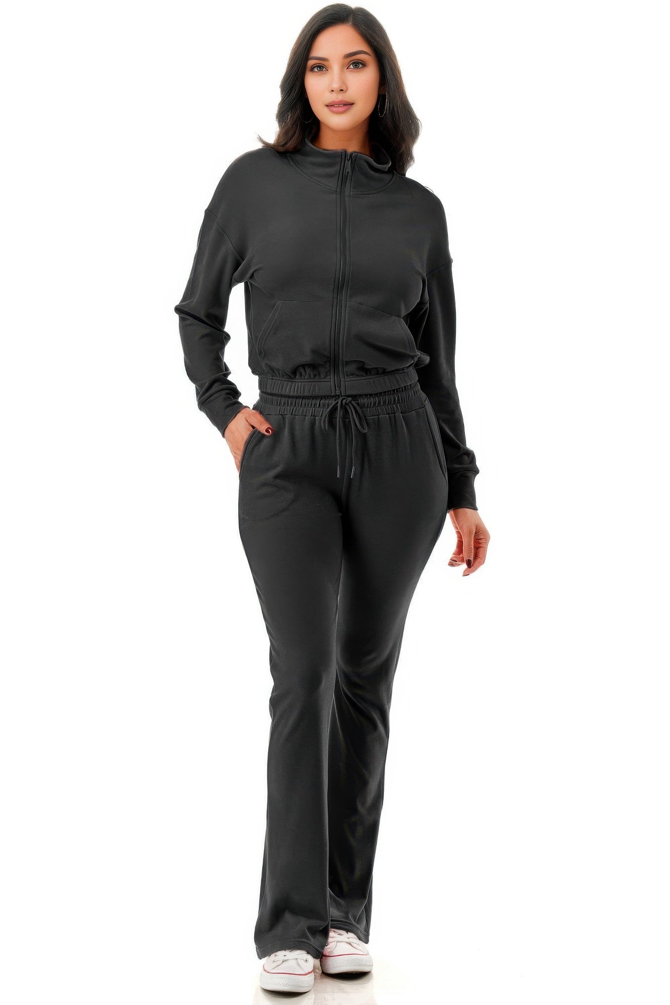 A women in thermal jacket and pant set on a white background