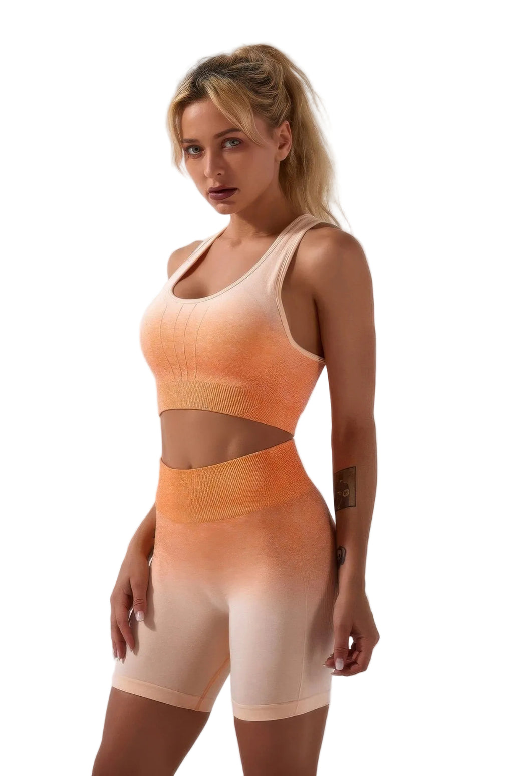 Woman wearing a peach-colored athletic outfit on a white background