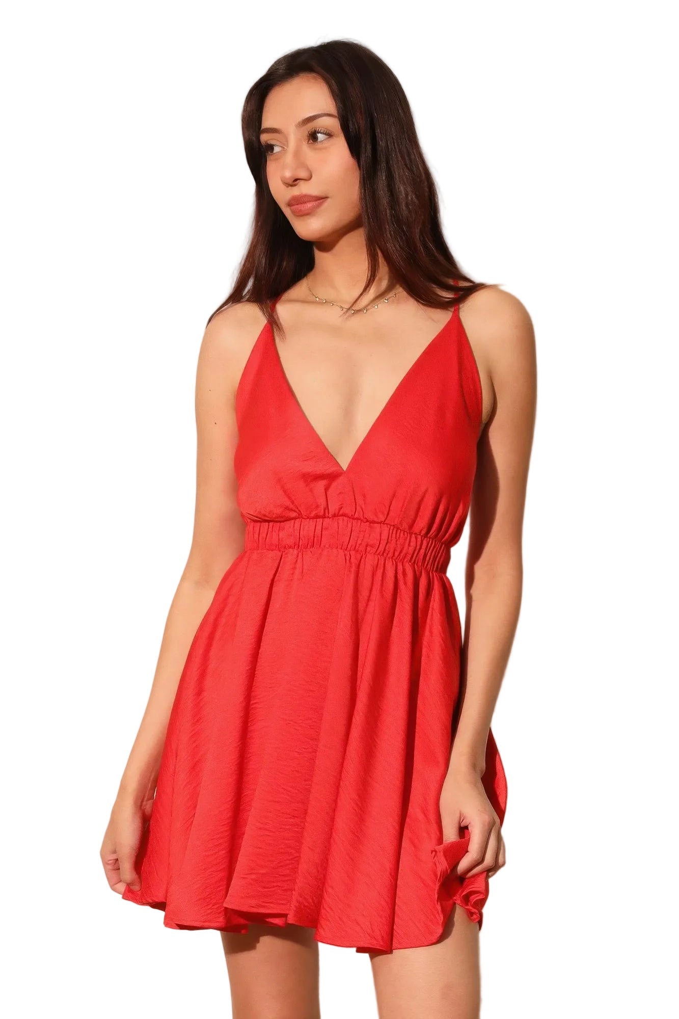 Woman wearing a red dress against a plain background