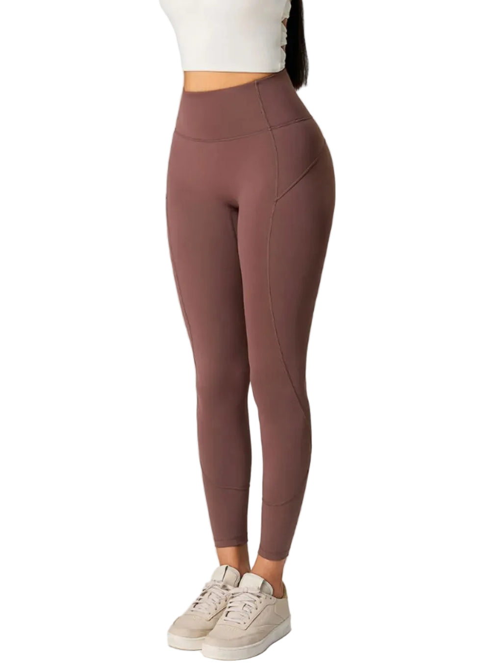 Brown leggings worn by a person on a white background