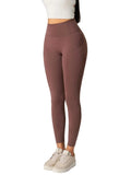 Brown leggings worn by a person on a white background