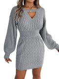 Gray knitted dress worn by a person on a white background