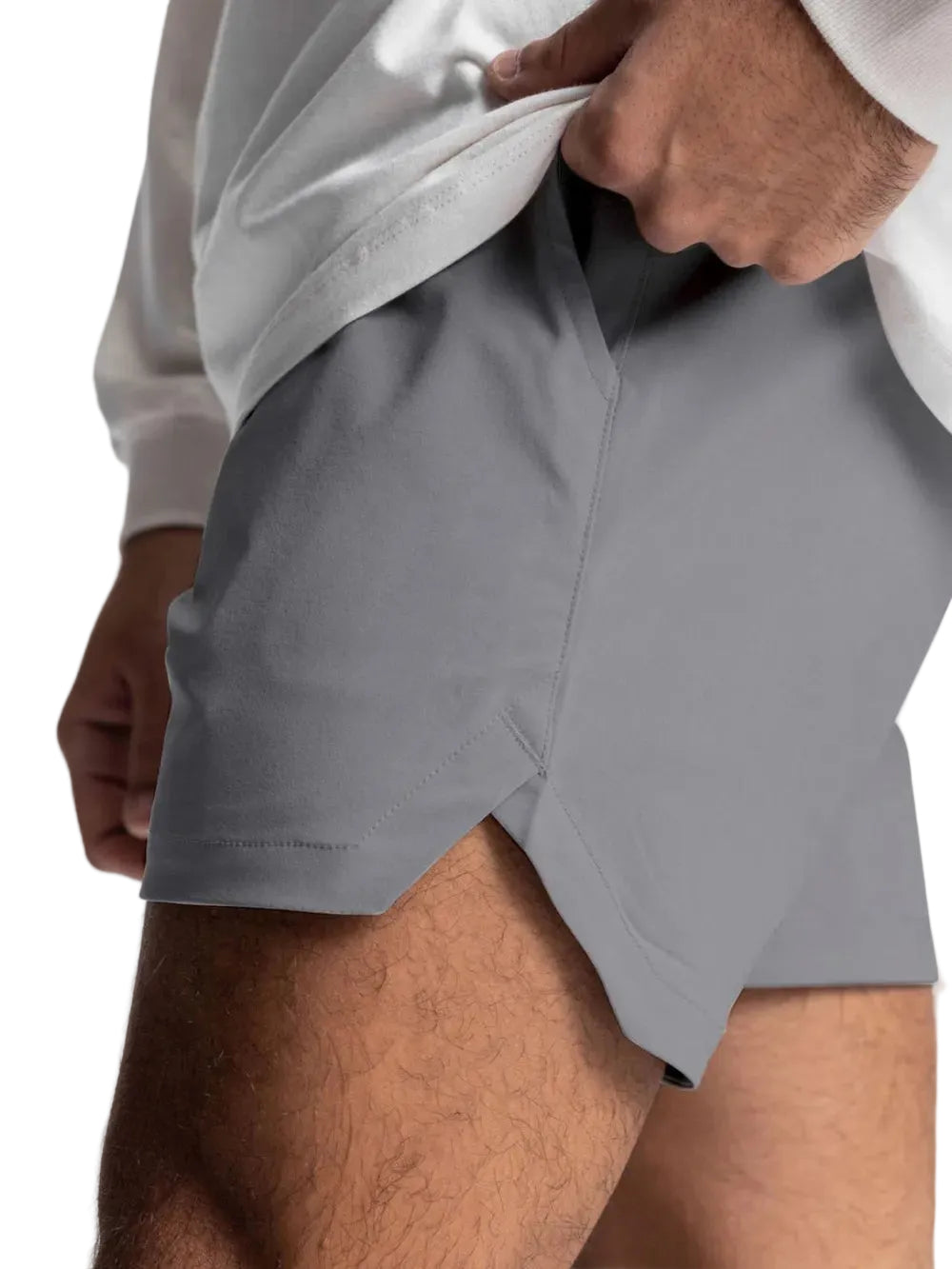 Gray athletic shorts worn by a person on a white background