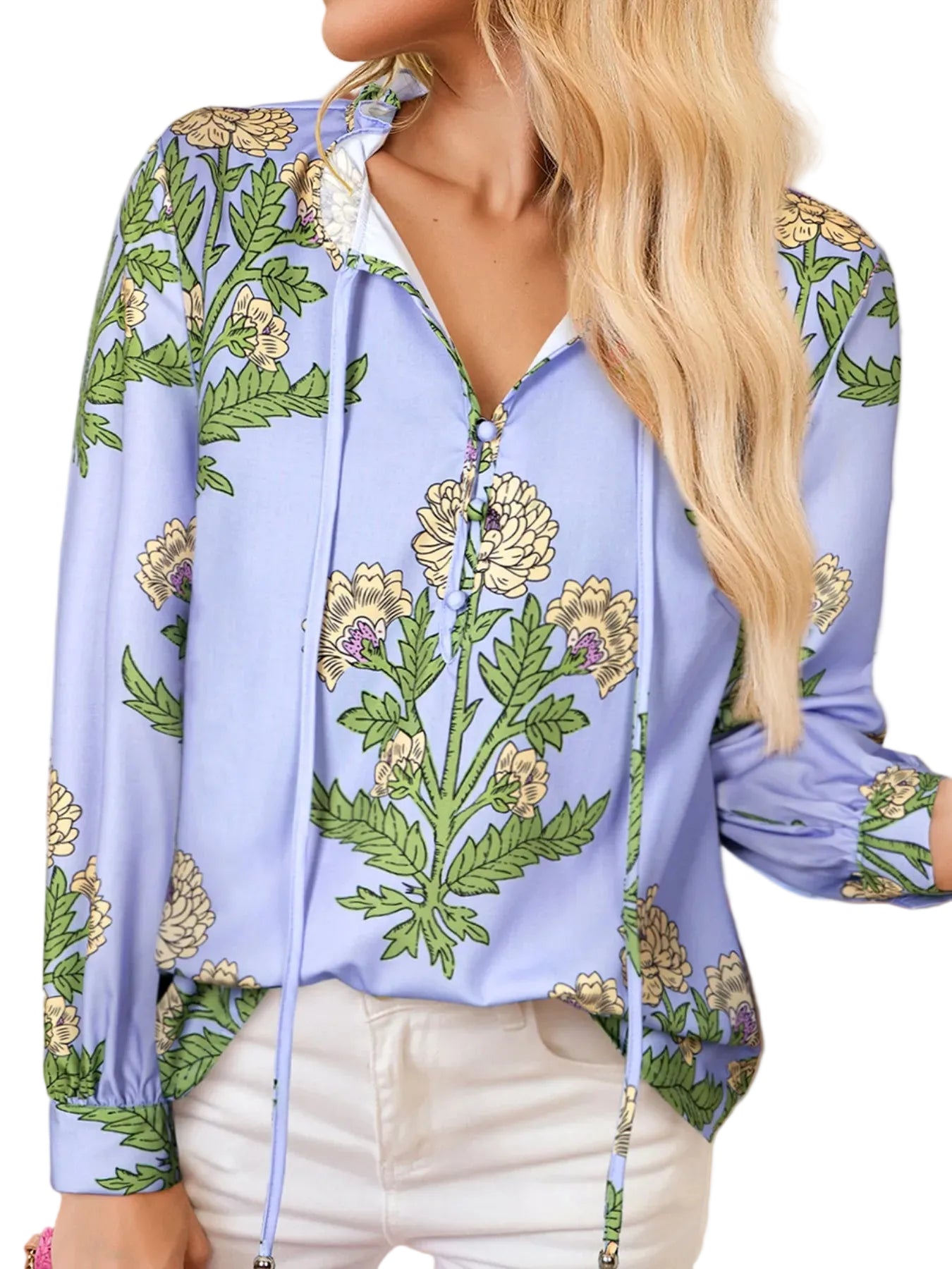Woman wearing a blue floral hoodie with green leaves and yellow flowers.