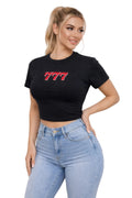 Woman wearing a black t-shirt with red text and light blue jeans against a white background