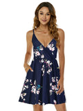 Woman wearing a navy floral dress on a white background