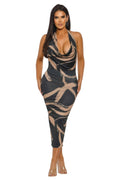 Woman wearing a patterned dress on a white background