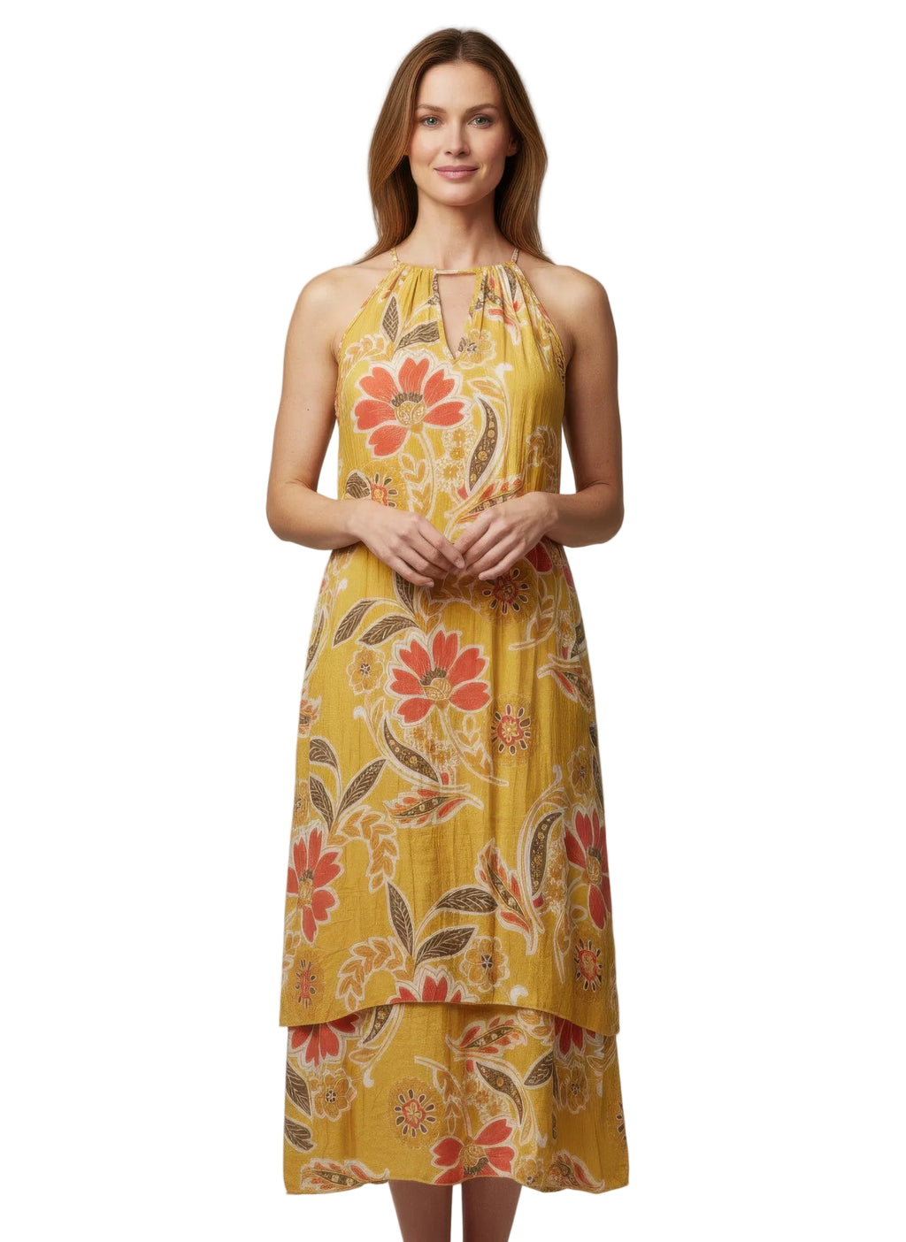 Woman wearing a yellow floral dress against a gray background