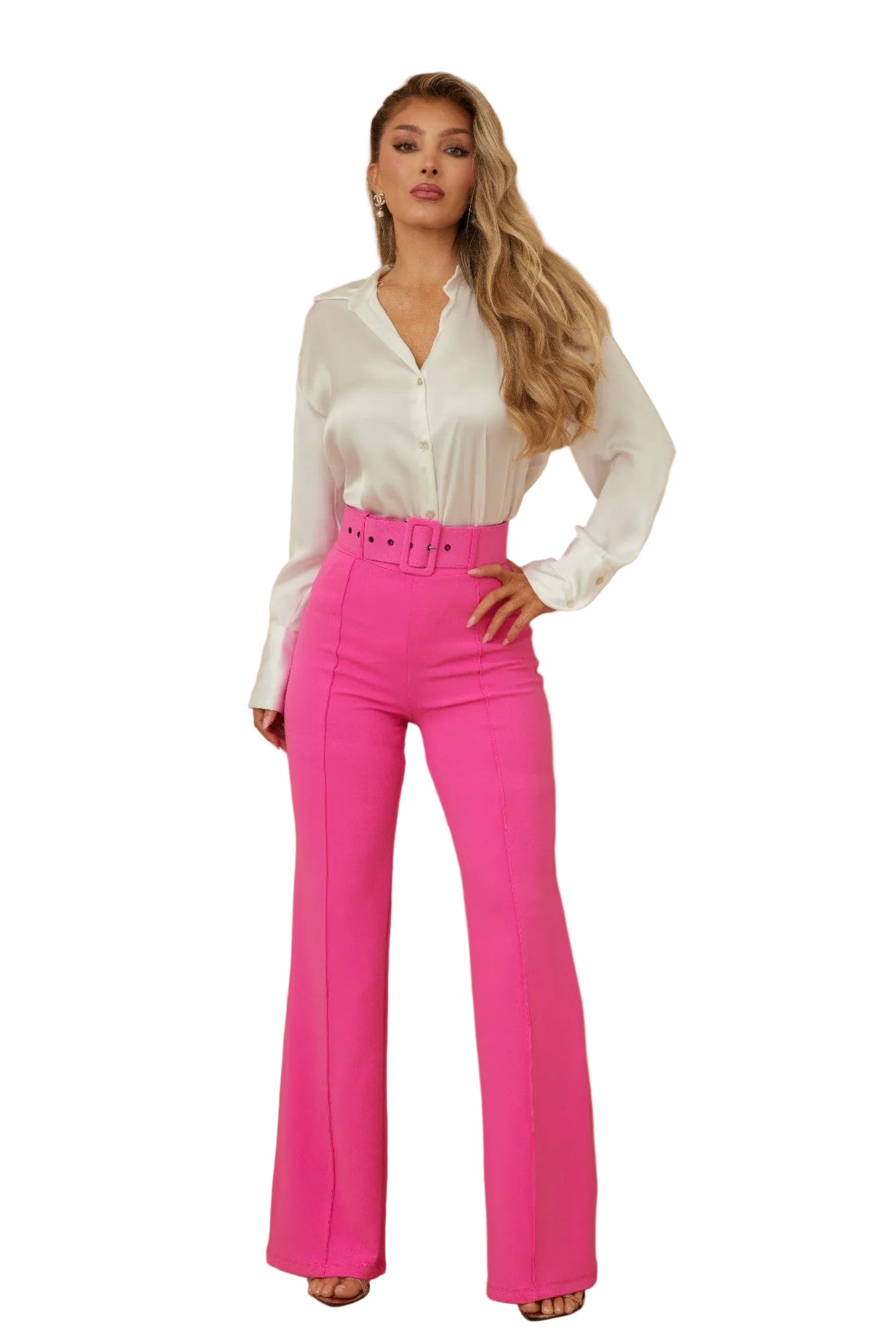 Woman wearing a white blouse and pink pants against a beige background