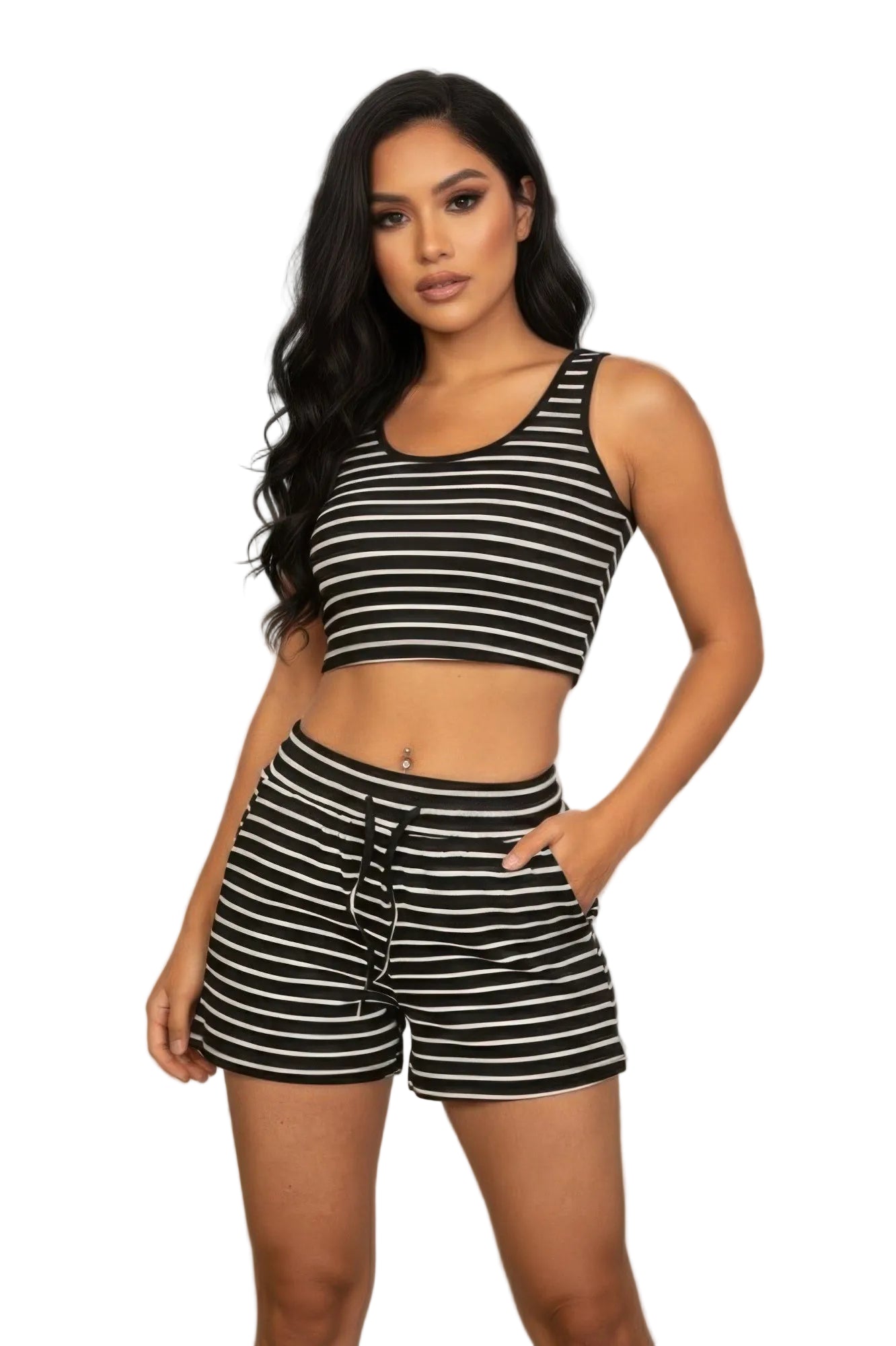 Woman wearing a black and white striped outfit in front of a window with a cityscape view.