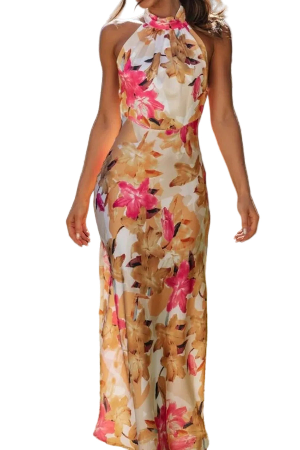 Woman wearing a floral dress standing on grass with a blurred background