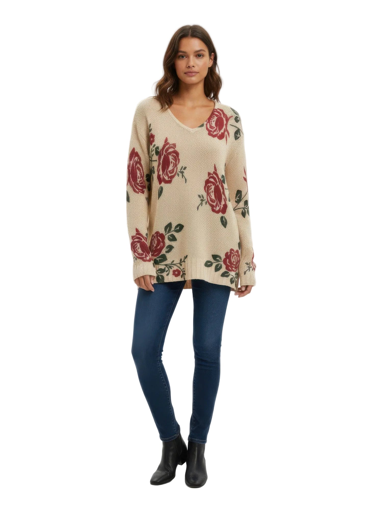 Woman wearing a beige sweater with red floral patterns on a white background