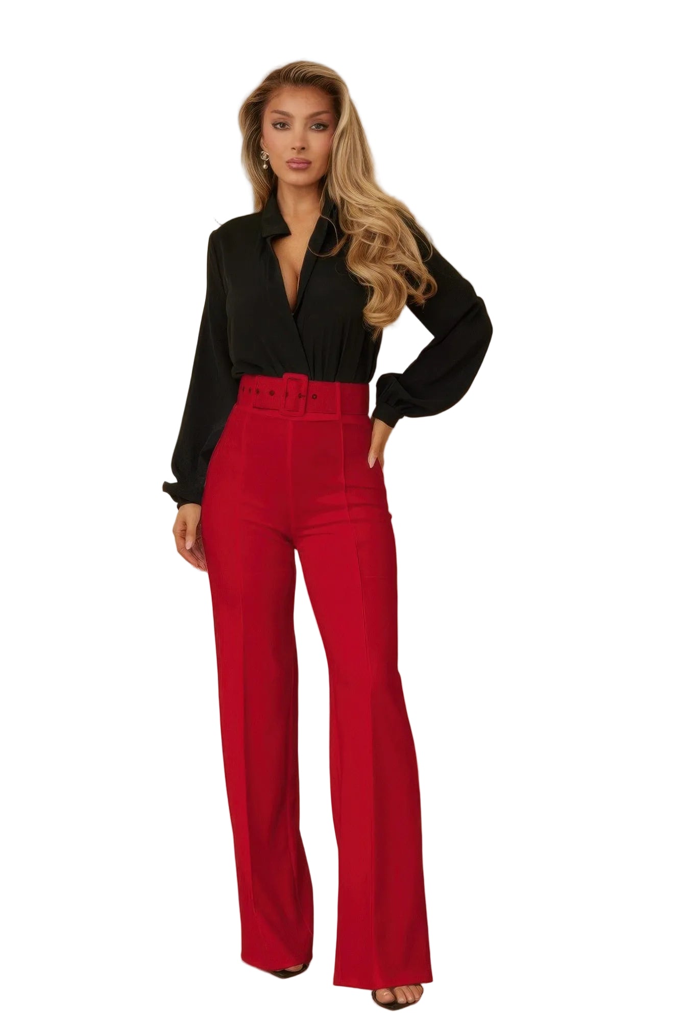 Woman wearing a black blouse and red pants against a beige background