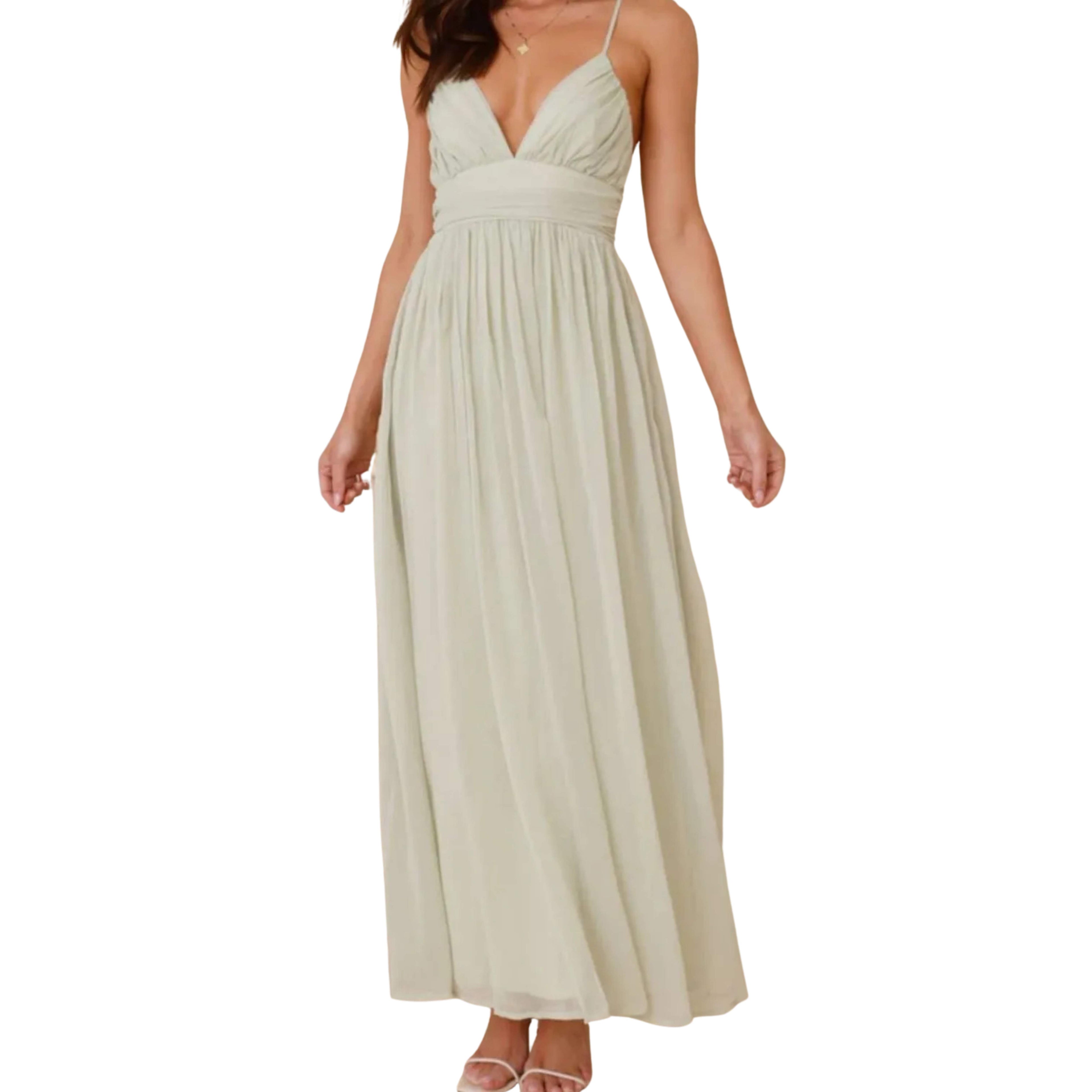 Beige cami dress worn by a model on a white background