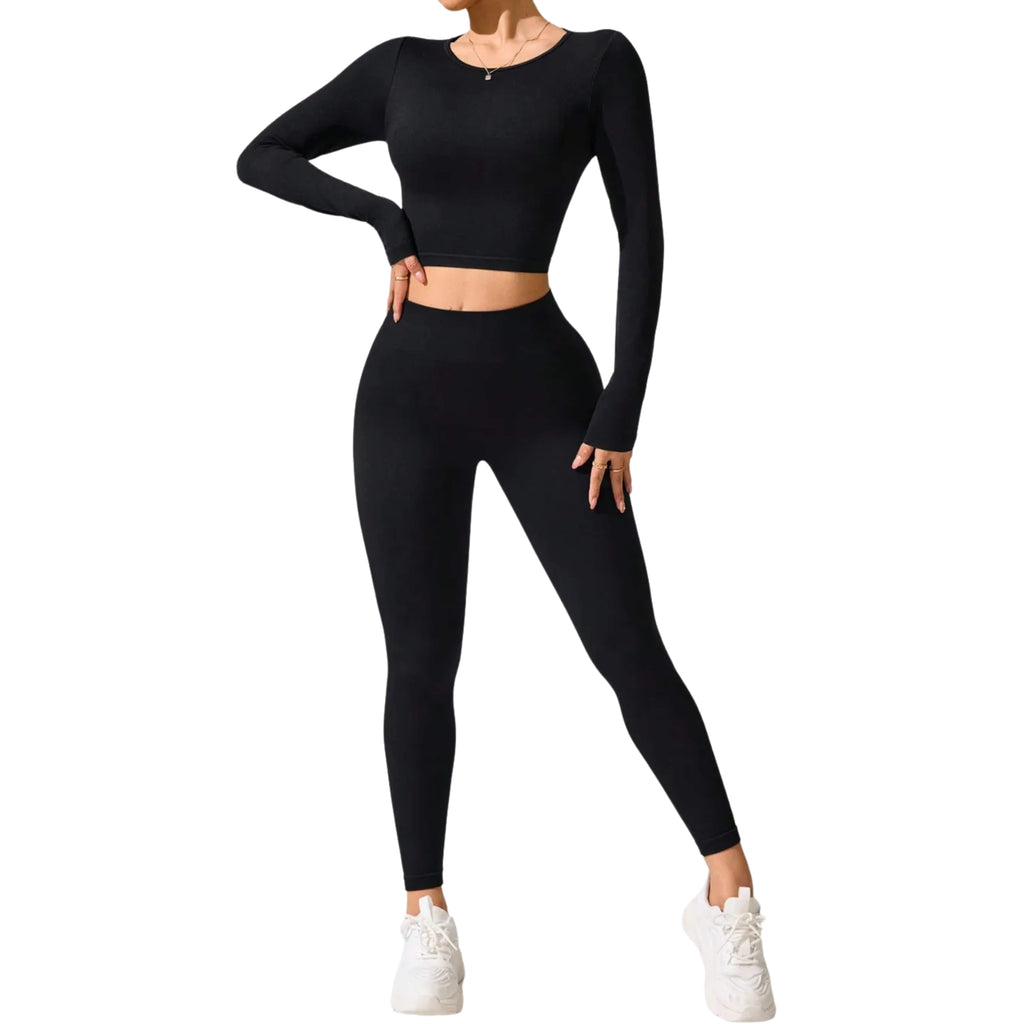 Black athletic outfit with long-sleeve top and leggings on a white background
