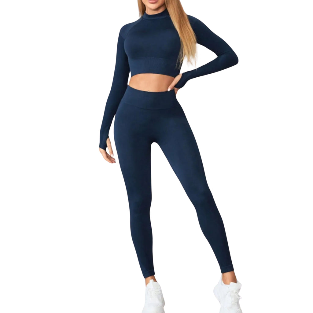 A woman wearing a navy blue long sleeve crop top and high-waisted leggings active set.