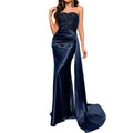 Navy blue strapless evening gown with sequin detailing on a white background