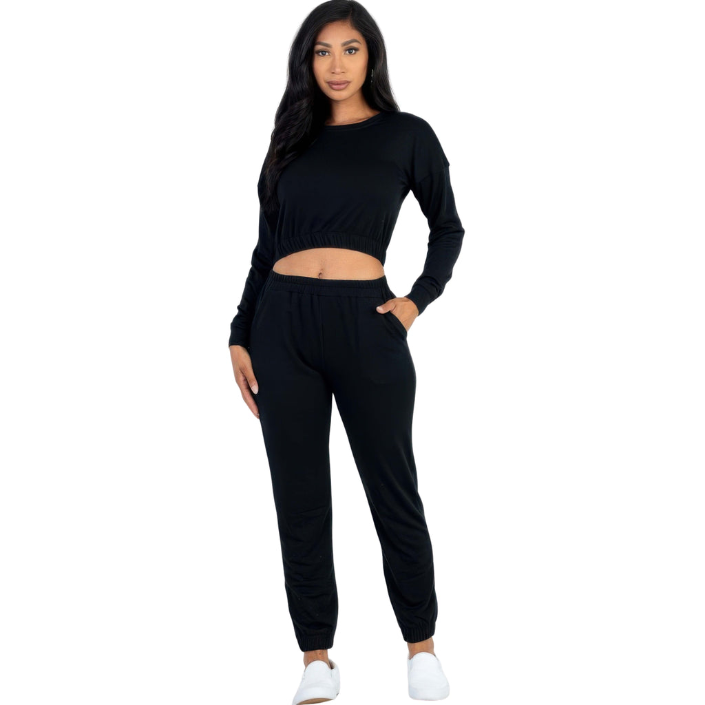 Woman wearing a black outfit on a white background