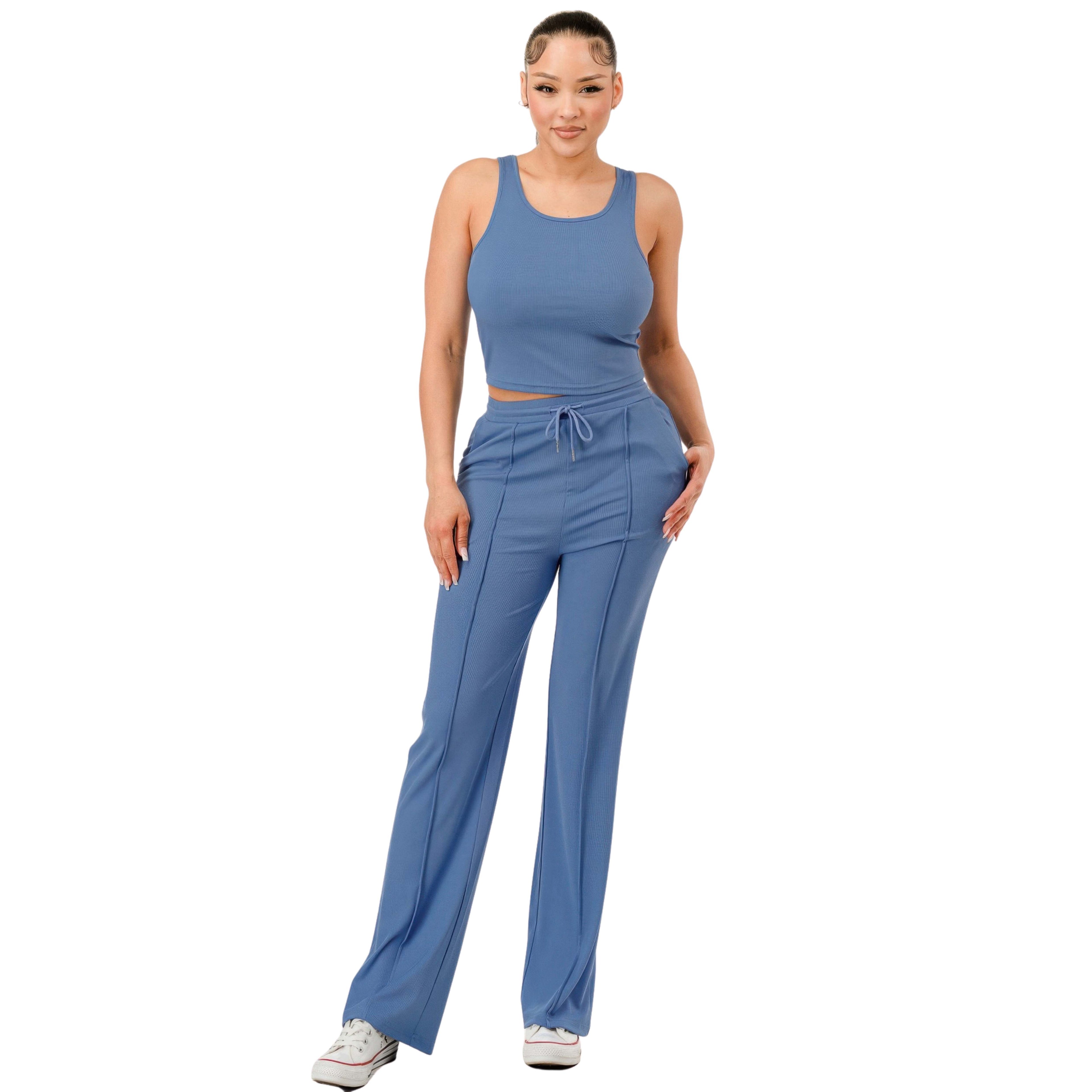Woman wearing a blue athletic outfit on a white background