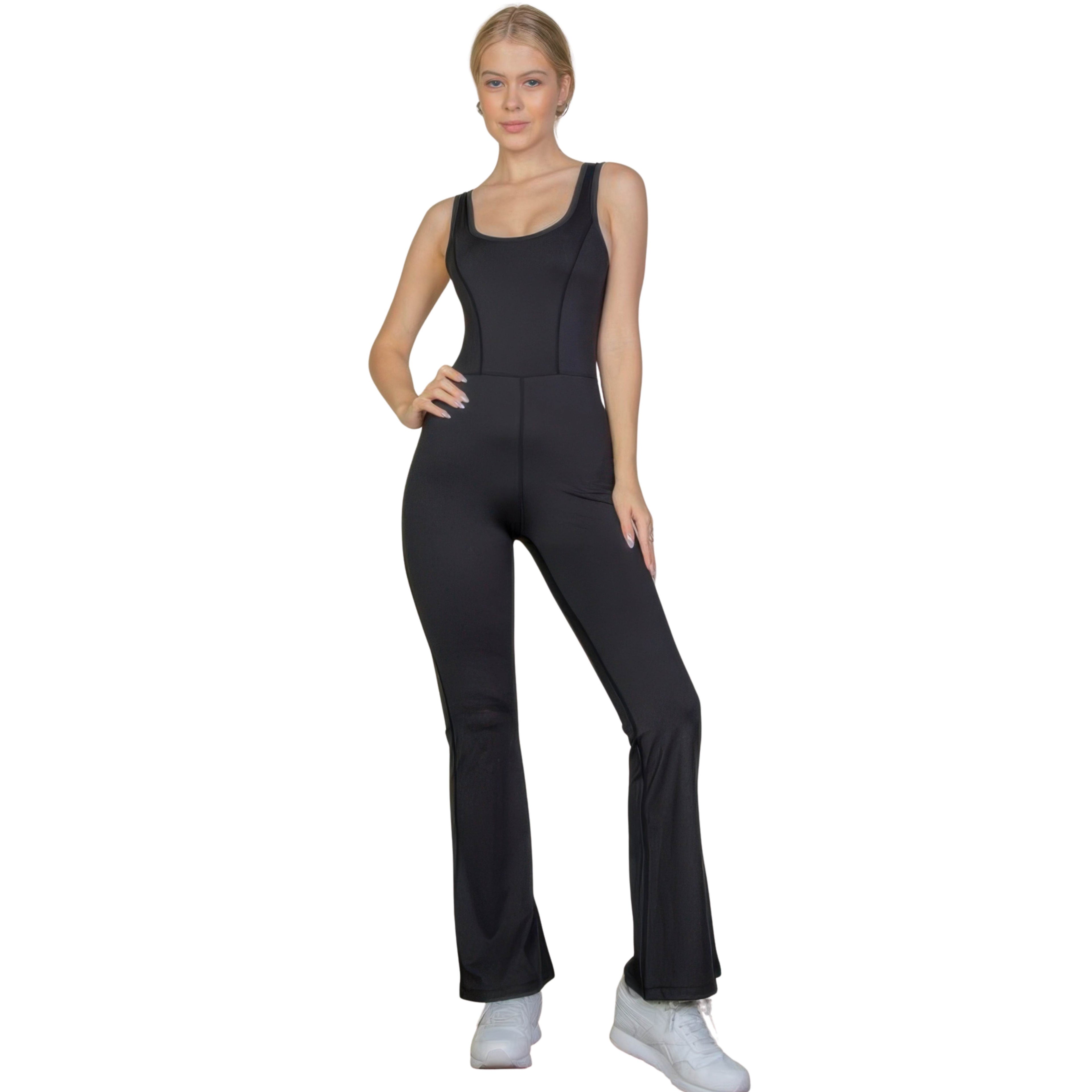 Woman wearing a black jumpsuit on a white background