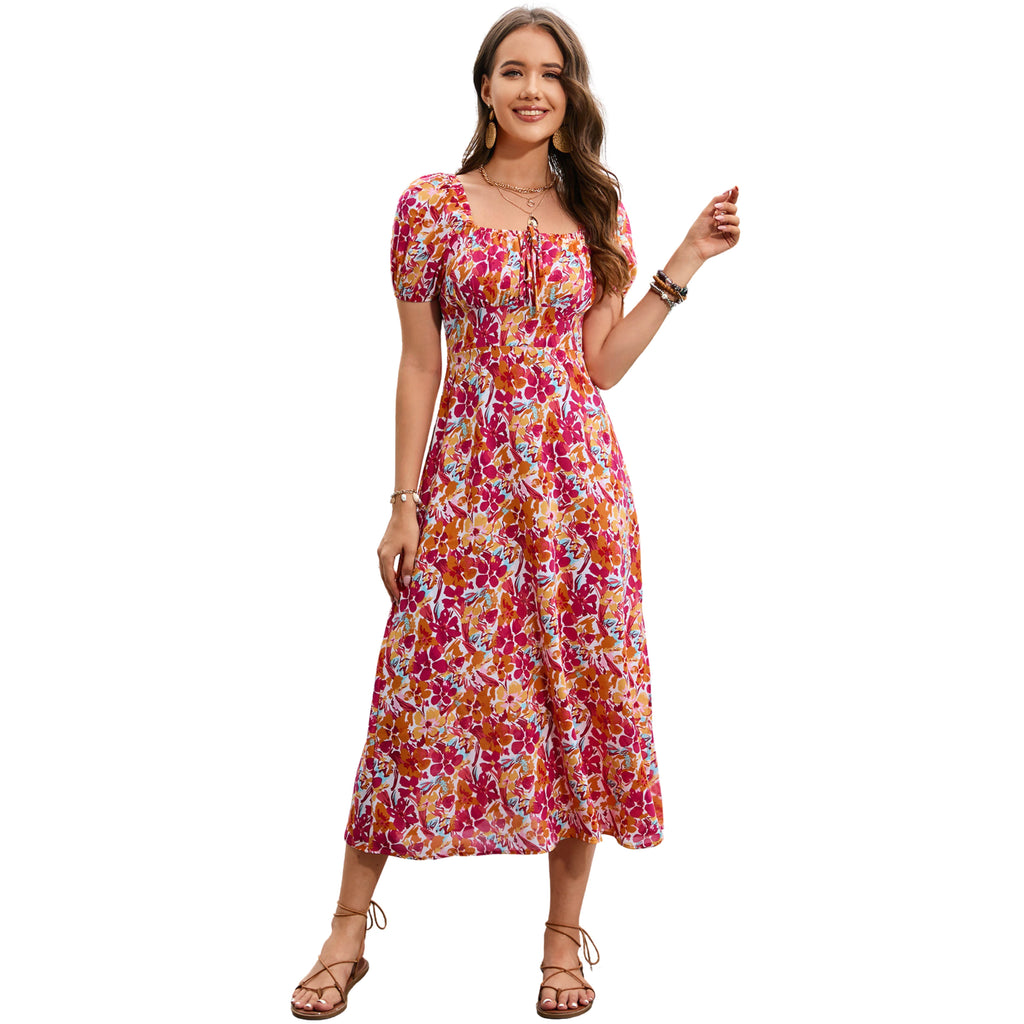 Woman wearing a colorful floral dress on a white background