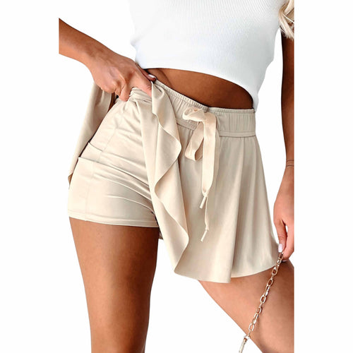 a women model wearing skorts with a white background.