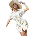 Woman wearing a white dress with animal prints and a large straw hat on a white background