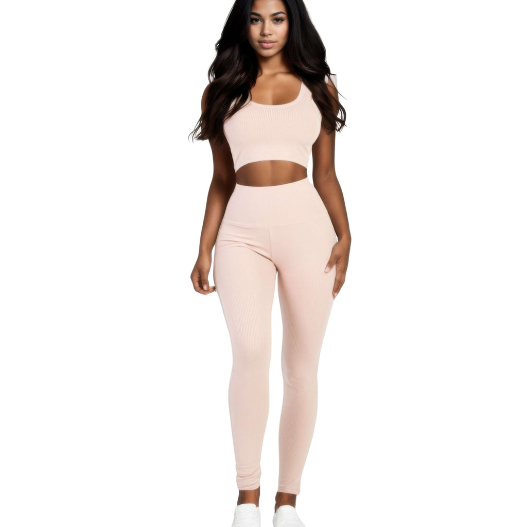 Woman wearing a pink athletic outfit on a white background