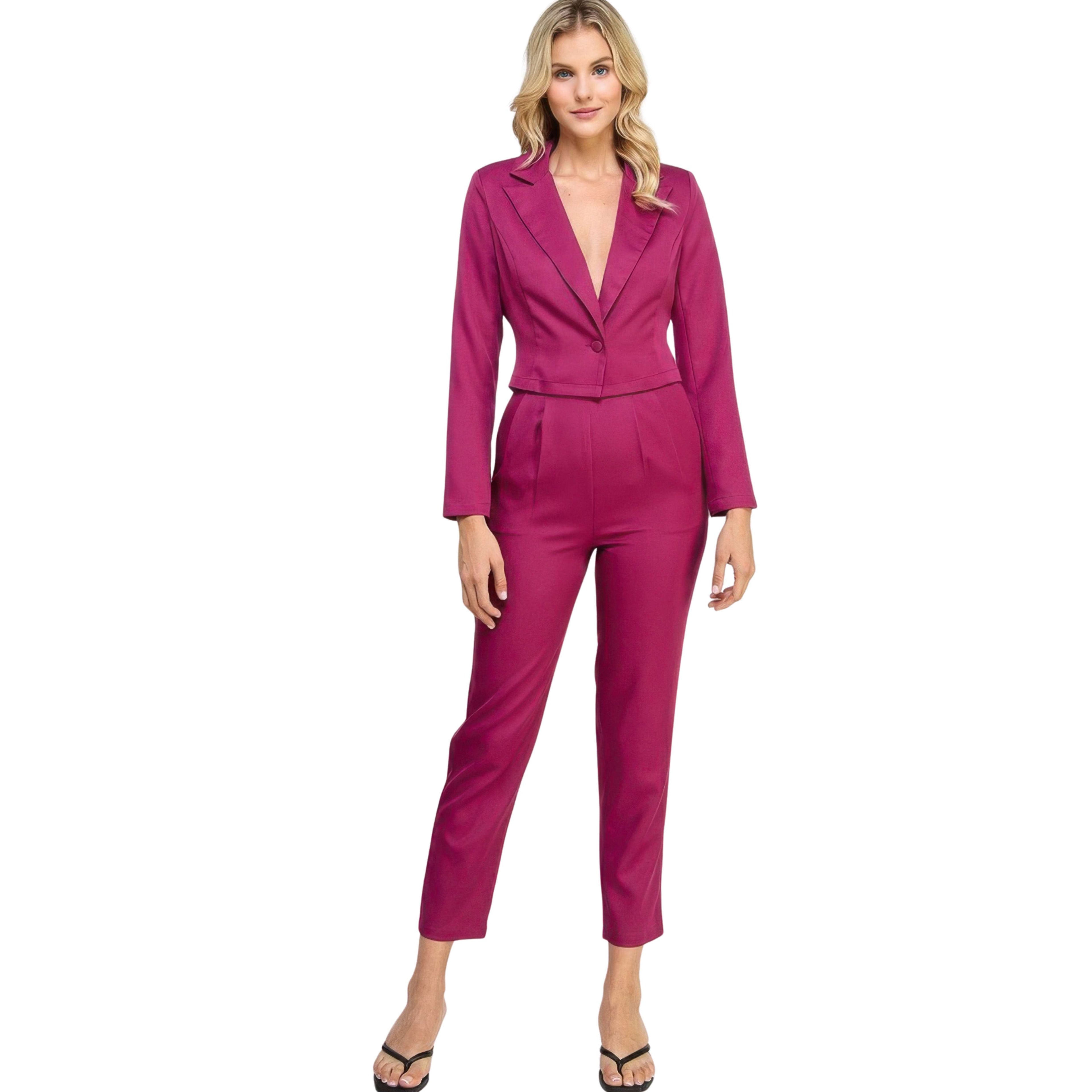 Woman wearing a magenta suit on a white background
