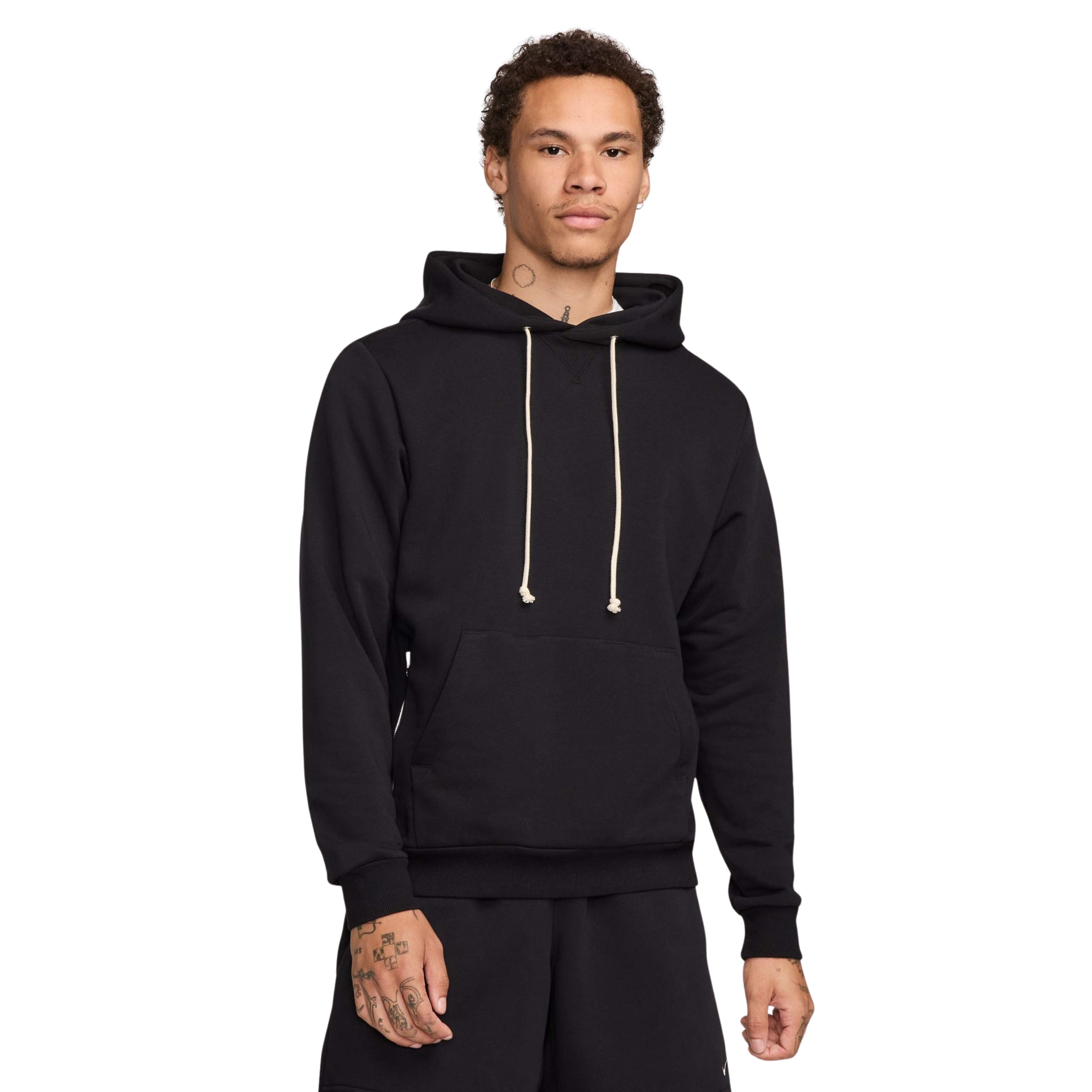 Man wearing a black Nike hoodie on a white background