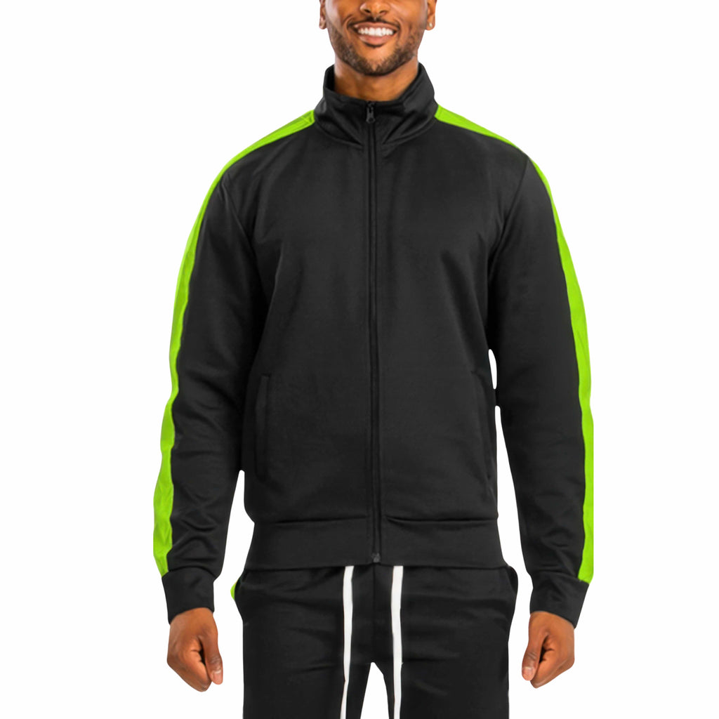 Man wearing a black tracksuit with green stripes on a white background