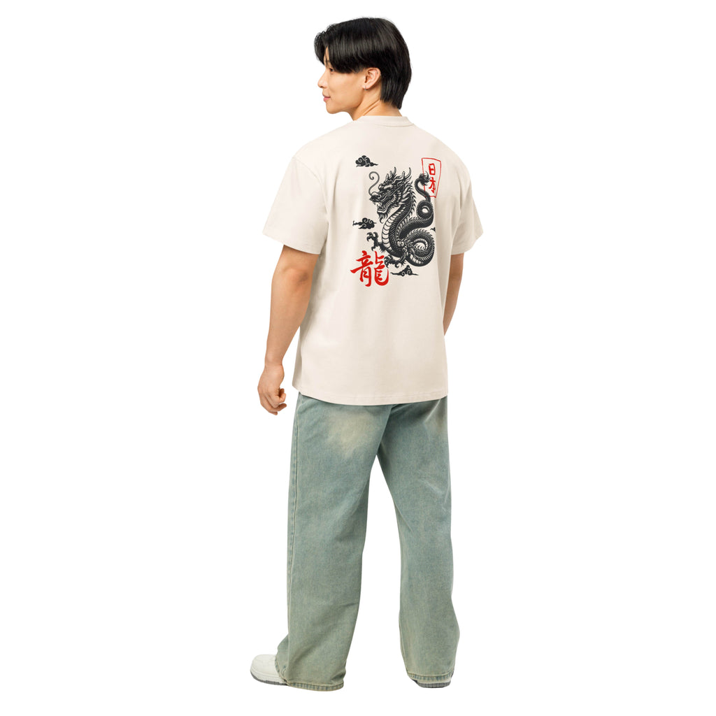 Person wearing a white t-shirt with a dragon design on the back, standing against a white background