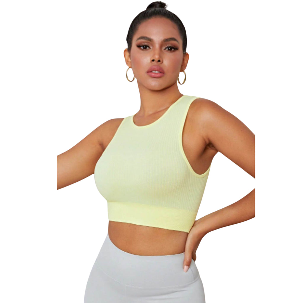 A woman wearing a yellow round neck long active bra with a sleeveless design.