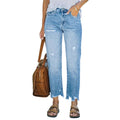 Women wearing light blue distressed jeans with a brown leather bag on a white background