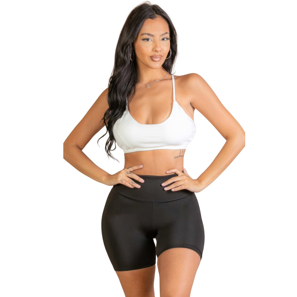 Women wearing a sports bra with white background