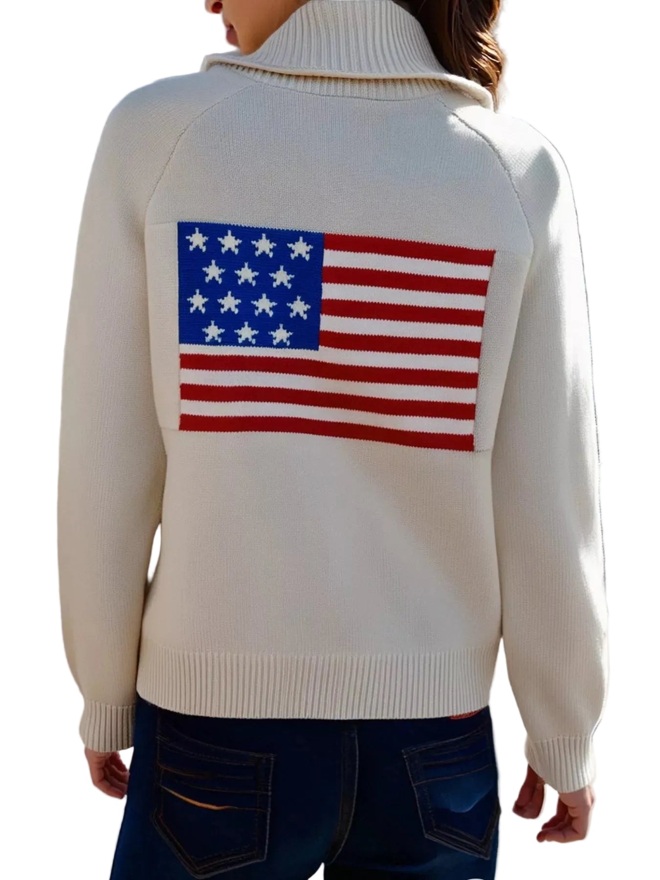 Person wearing a sweater with an American flag on the back, standing in front of a building.