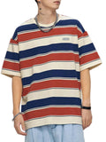 Person wearing a striped t-shirt with red, blue, and beige horizontal stripes on a plain background.