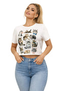 Woman wearing a white t-shirt with cat illustrations and blue jeans against a plain background