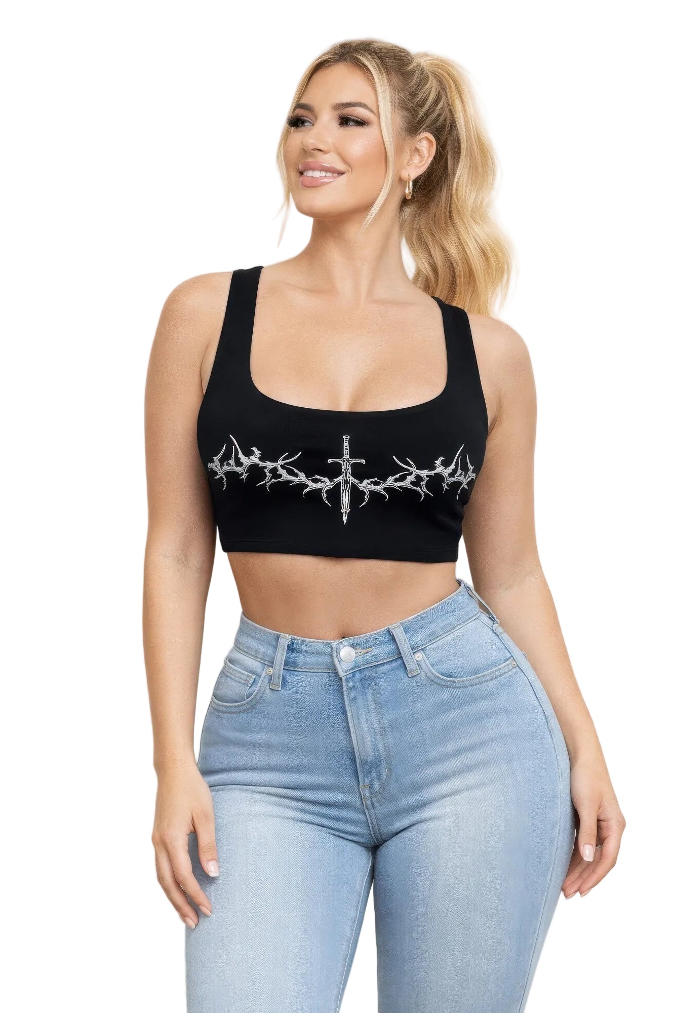 Woman wearing a black crop top with white embroidery and light blue jeans against a beige background