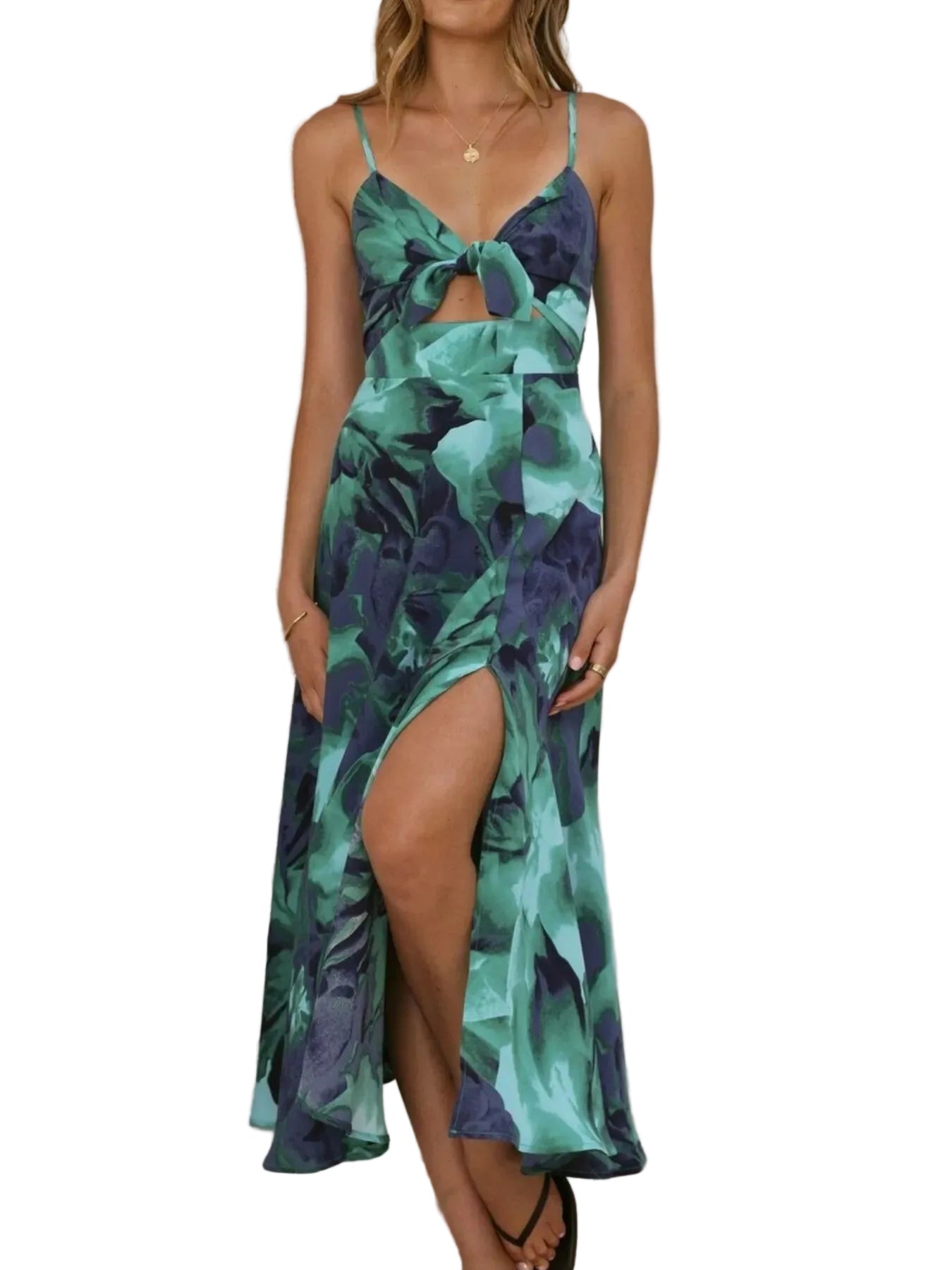 Woman wearing a green and purple floral dress with a white background