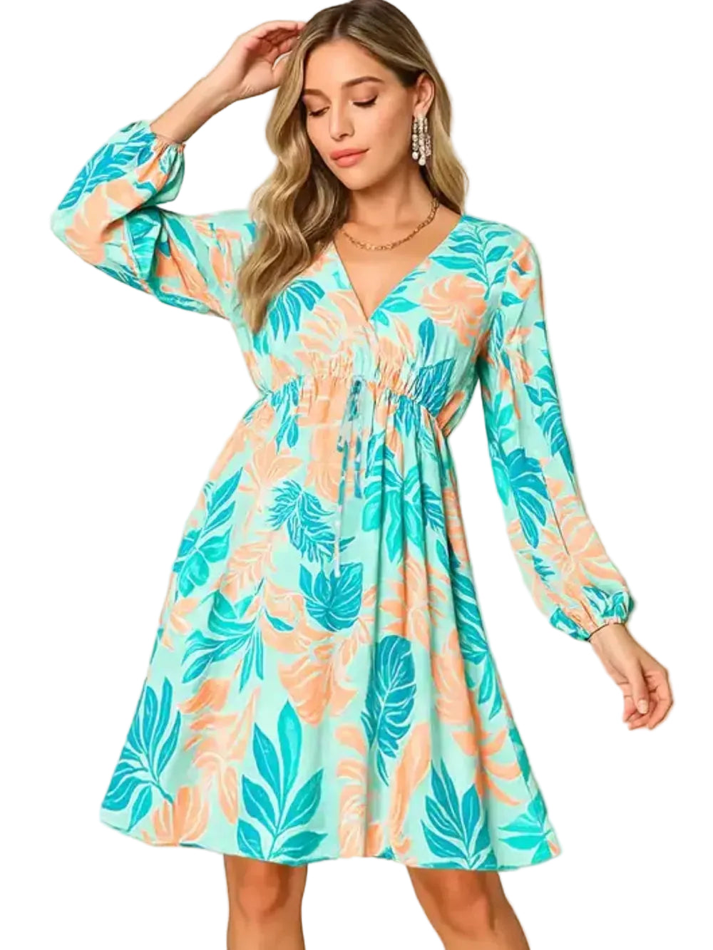 Woman wearing a colorful floral dress with long sleeves on a beige background