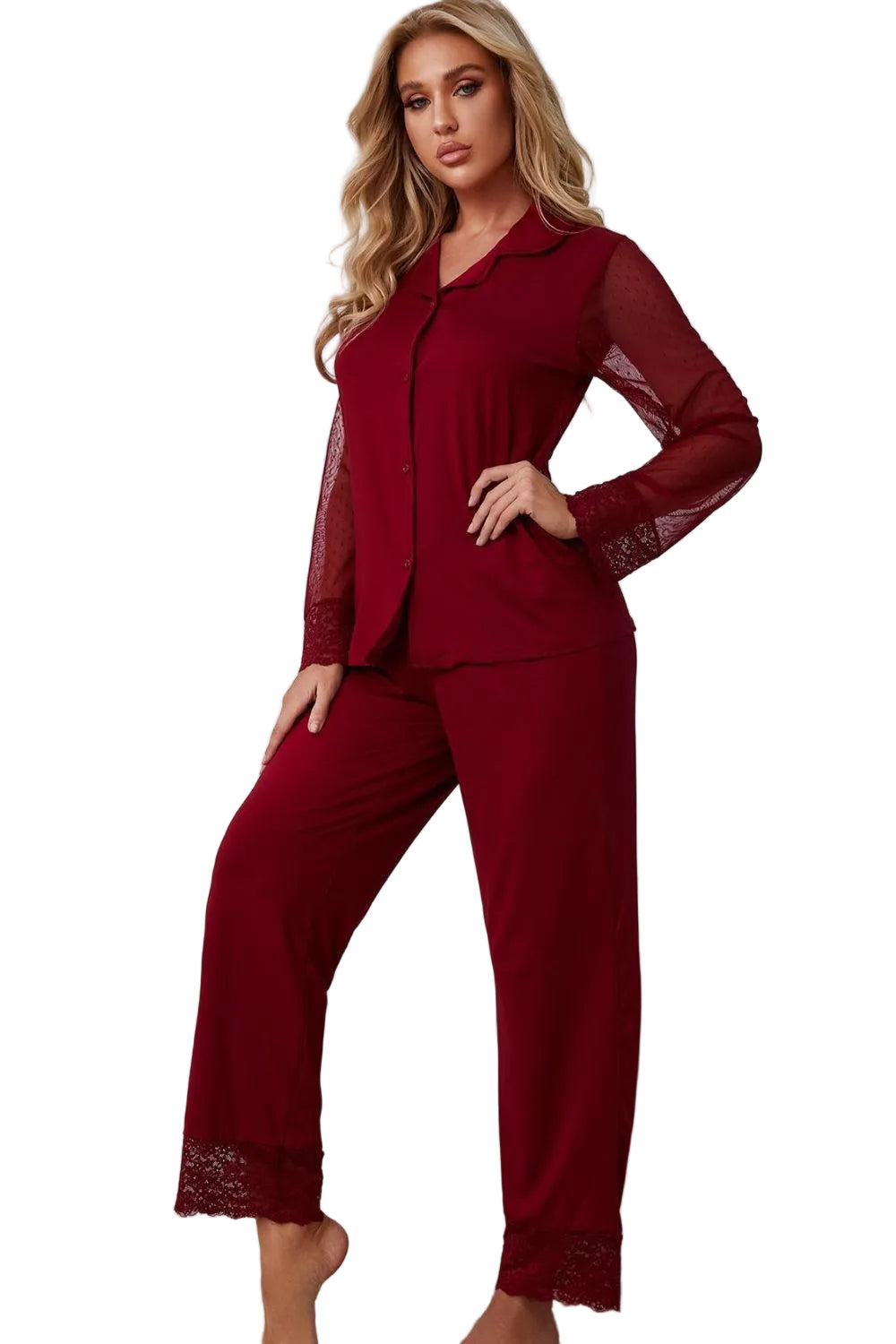 Woman wearing a burgundy pajama set with lace details against a white background