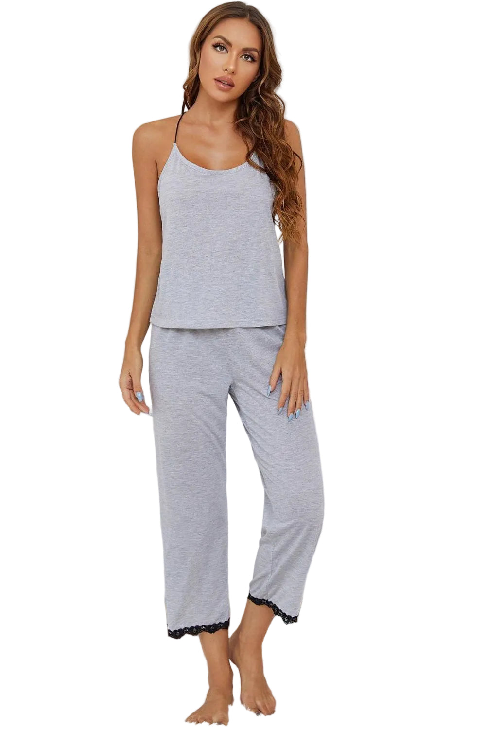 Woman wearing gray pajamas in a bathroom setting