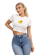 Woman wearing a white crop top with a yellow rubber duck graphic and high-waisted blue jeans against a plain background.