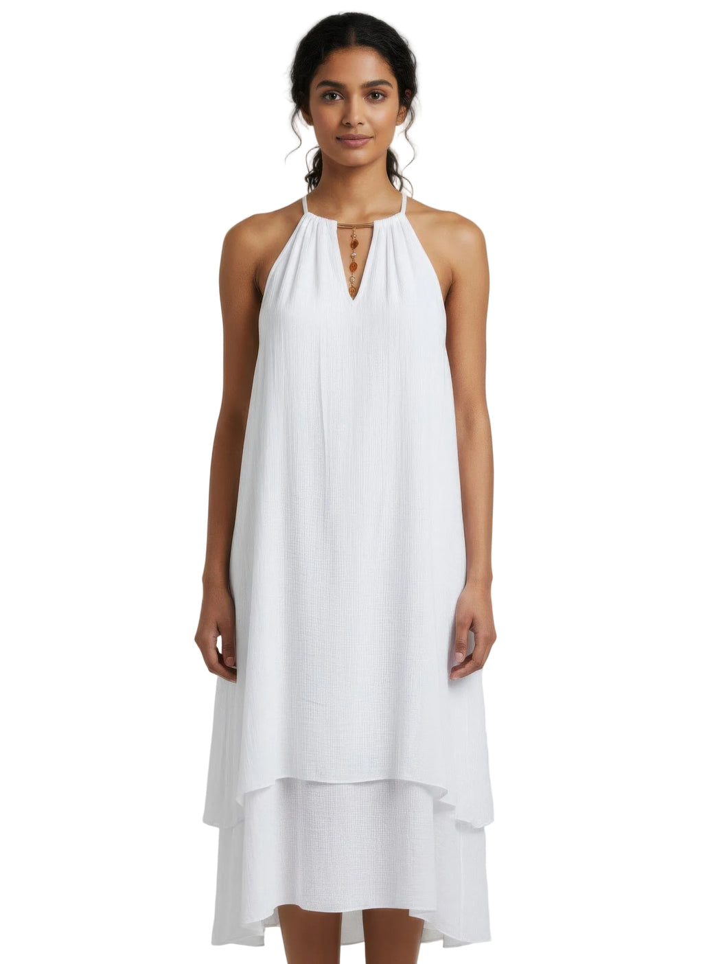 Woman wearing a white dress against a plain background