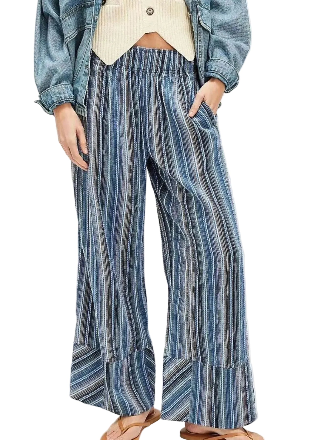 Person wearing blue and white striped wide-leg pants with a denim jacket on a white background