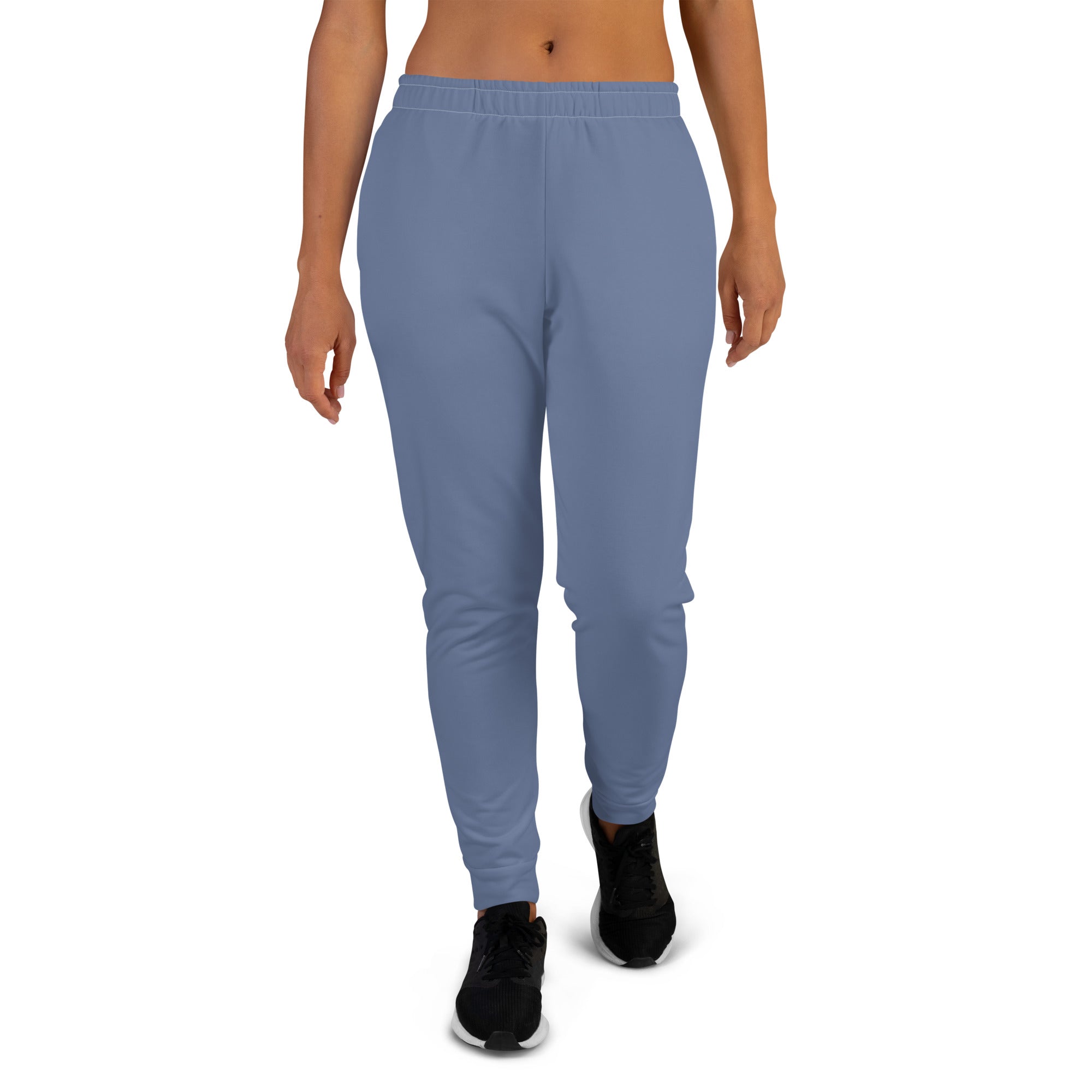 a women wearing a jogger pant with white background